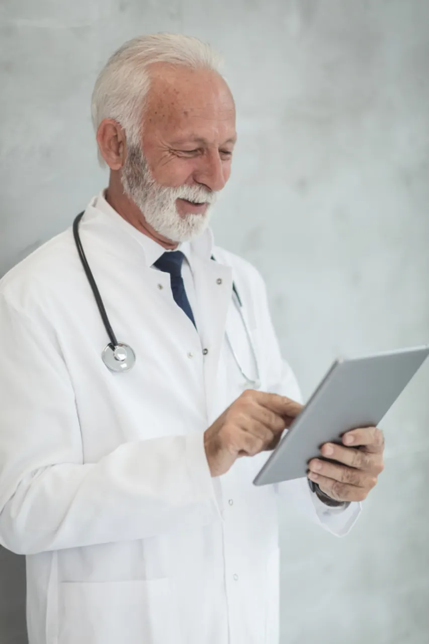 Portrait of a physician holding a tablet